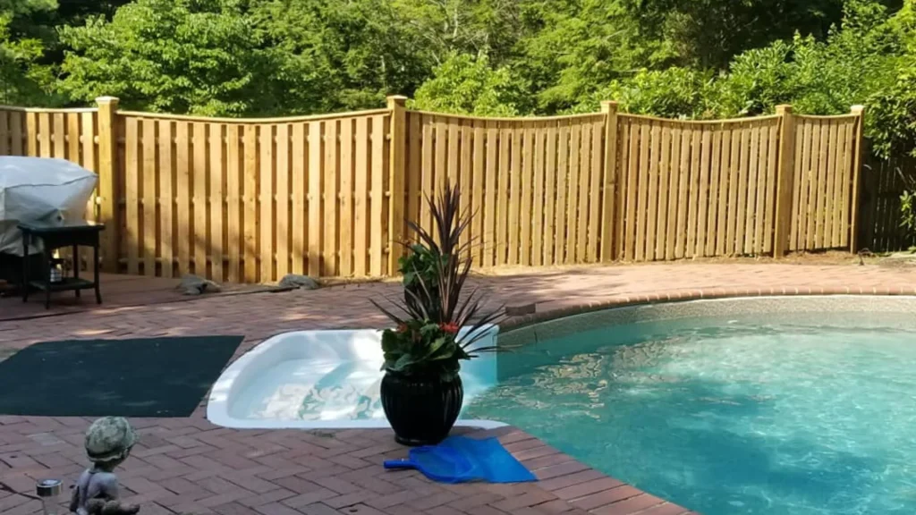 Vinyl fence installation on backyard pool - North Smithfield Fence