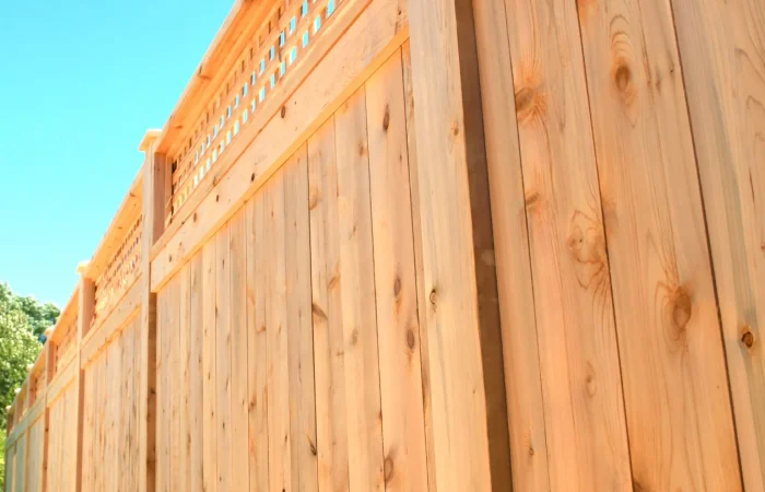 cedar privacy fence with clear blue sky background