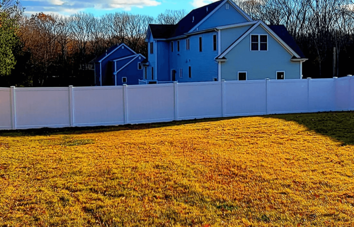 Slopped terrain fence installation project - North Smithfield Fence